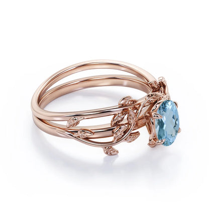 Four Prong Set 1.3 Carat Oval Shaped Light Blue Created Aquamarine Vine Leaf Design Wedding Set in 18K Rose Gold Plating over Silver