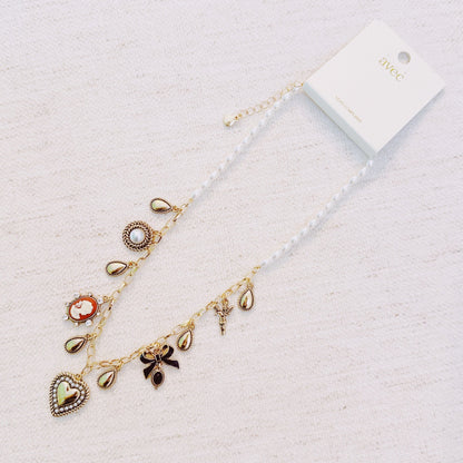 Heart & Cameo Charm Necklace – Romantic Gold Chain with Bow and Vintage-Inspired Details