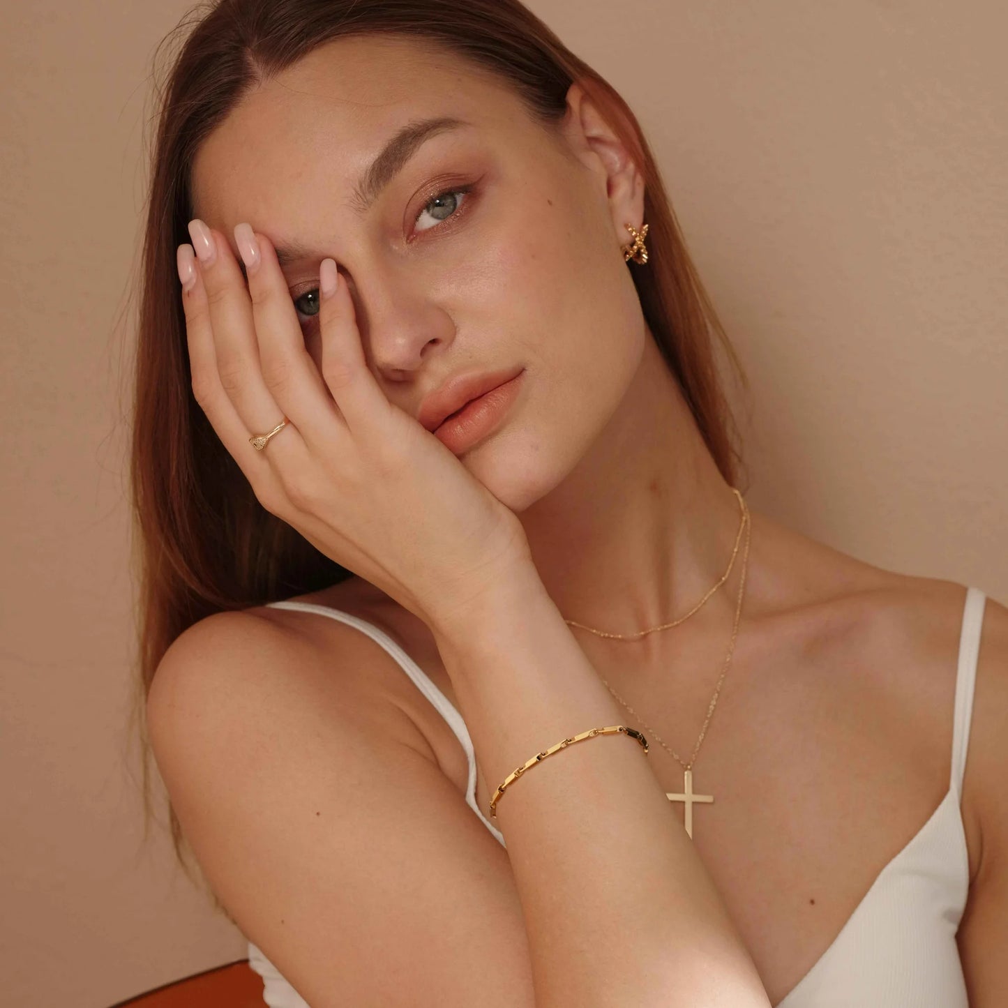 Woman wearing gold jewelry 